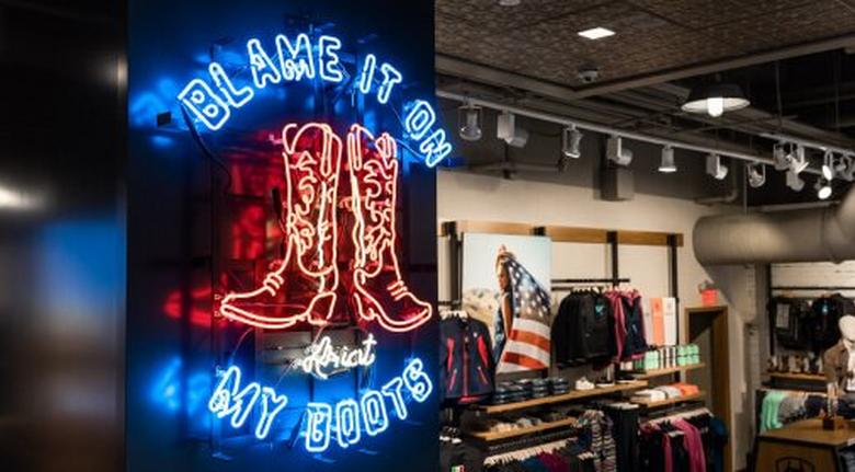 neon sign blame it on my boots
